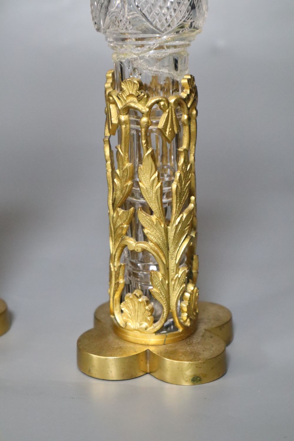 A pair of 19th century cut glass bottles and stoppers in ormolu stands (damage) and sundry other glassware